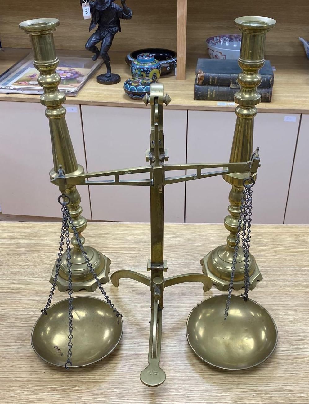 A pair of brass altar candlesticks, 60cm and a pair of Beam scales to weight 2lb, height 56cm